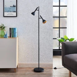 Lucande Stehleuchte Nordwin, 2-flammig, Schwarz-gold -Lucande 9624535 1